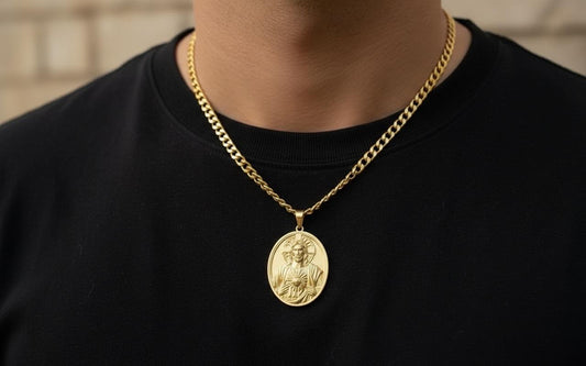 14k solid gold oval Jesus pendant featuring a raised Christ figure, polished finish, and 6mm bail opening, measuring 40mm x 33mm and weighing approximately 13 grams